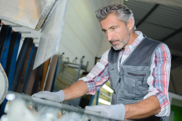 Worker Tending Machine — Stock Photo, Image