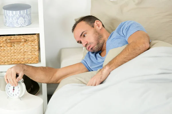 Bored Man Switching Alarm — Stock Photo, Image