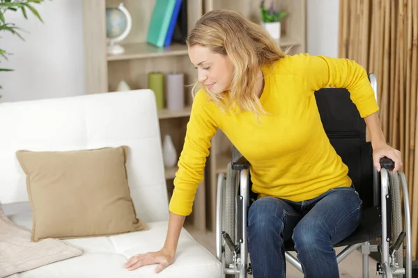 Woman Moving Wheelchair Sofa — Stock Photo, Image