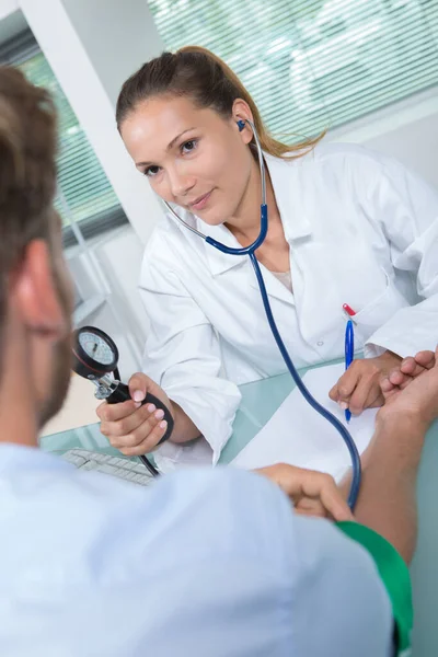 Female Doctor Medical Coat Testing Patients Blood Pressure — Stock Photo, Image