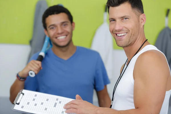 Tennis Trainer Holding Clipboard Student Smiling — Stock Photo, Image