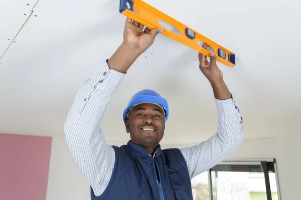 Young Plasterer Leveling Wall — Stock Photo, Image