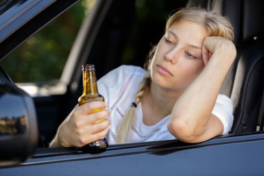 woman drinks beer while driving car clipart