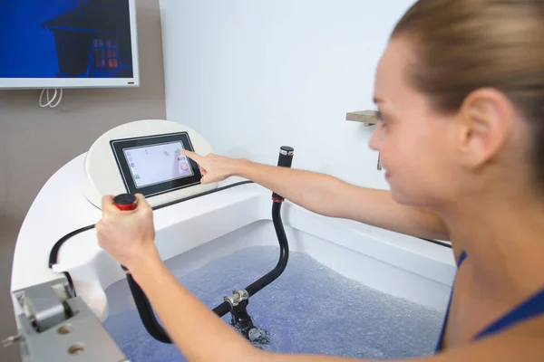 Woman Setting Her Aqubike Therapy Tub — Stock Photo, Image