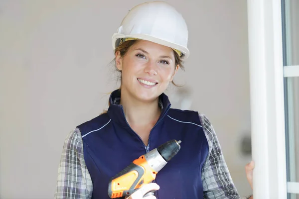 Pretty Young Smiling Woman Using Cordless Drill — Stock Photo, Image