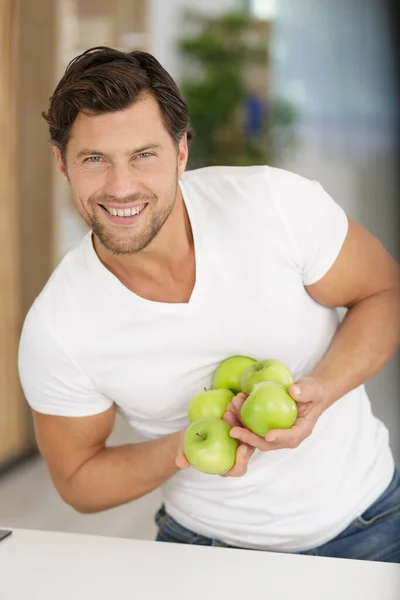 Smiling Man Holding Green Apples — Stock Photo, Image