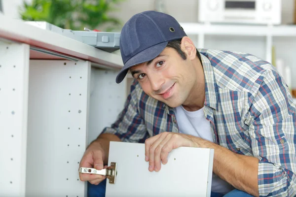 Professional Handyman Installing Cabinet Door Kitchen — Stock Photo, Image