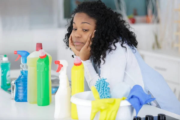 Happy Female Cleaner Looking Cleaning Products — Stock Photo, Image