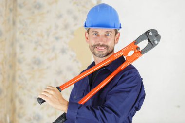 male builder holding bolt croppers clipart
