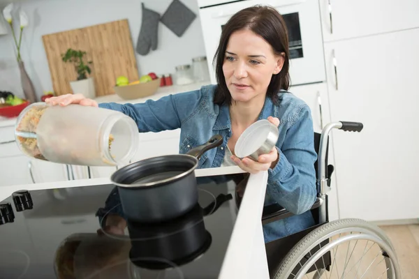 Disabled Woman Cooking Pasta Home — Stock Photo, Image