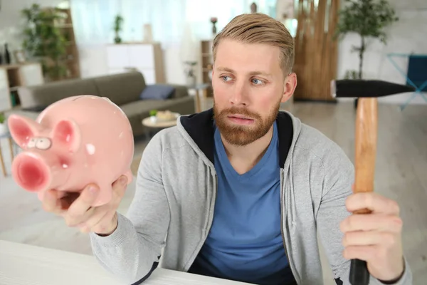 Man Holding Hammer Looking Regretfully His Piggy Bank — Stock Photo, Image