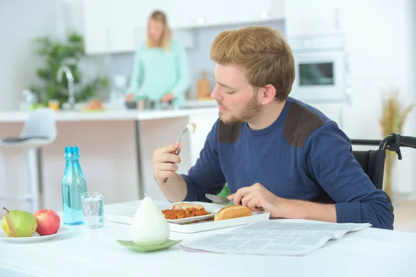 Disabled Man Wheelchair Eating Home — Stock Photo, Image