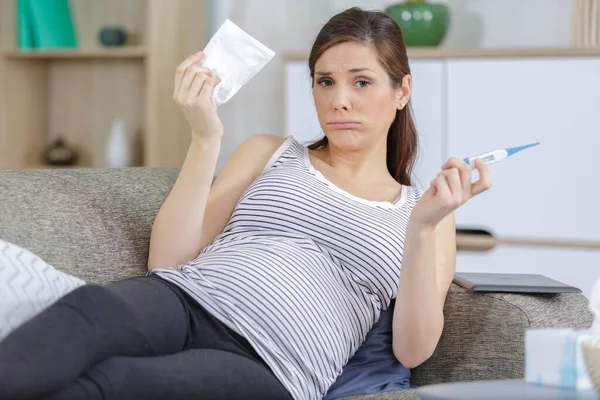 Miserable Pregnant Woman Holding Thermometer — Stock Photo, Image