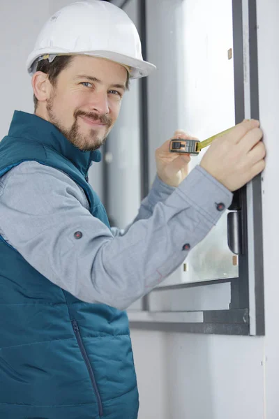 Young Engineer Using Tape Measure Measuring Window Site — Stock Photo, Image