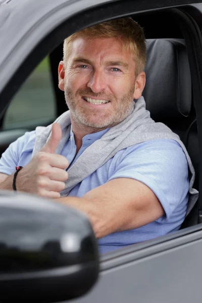 Happy Man Showing His Thumb While Driving Car — Stock Photo, Image