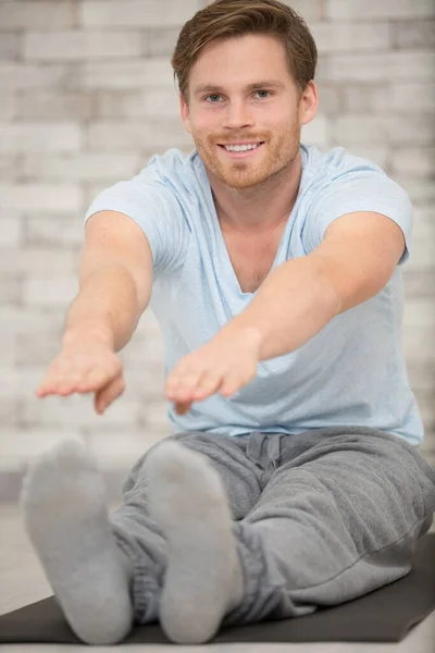 Handsome Young Man Doing Stretch Exercise Home — Stock Photo, Image