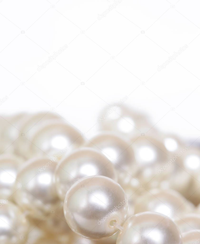 Pile of pearls on the white background