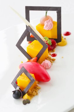 Beautiful elegant colorful dessert in a plate clipart