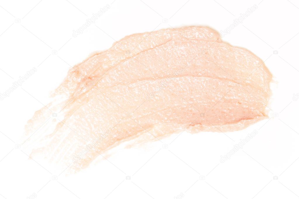 Cosmetics products smeared on white