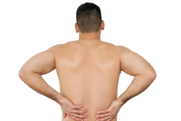 Studioaufnahme eines jungen Mannes mit Rückenschmerzen — Stockfoto