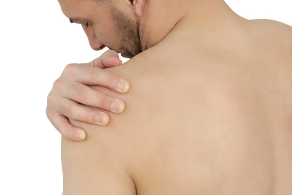 Studioaufnahme eines jungen Mannes mit Schulterschmerzen — Stockfoto
