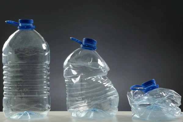 Single-use plastic bottles, studio shot. Plastic pollution concept.
