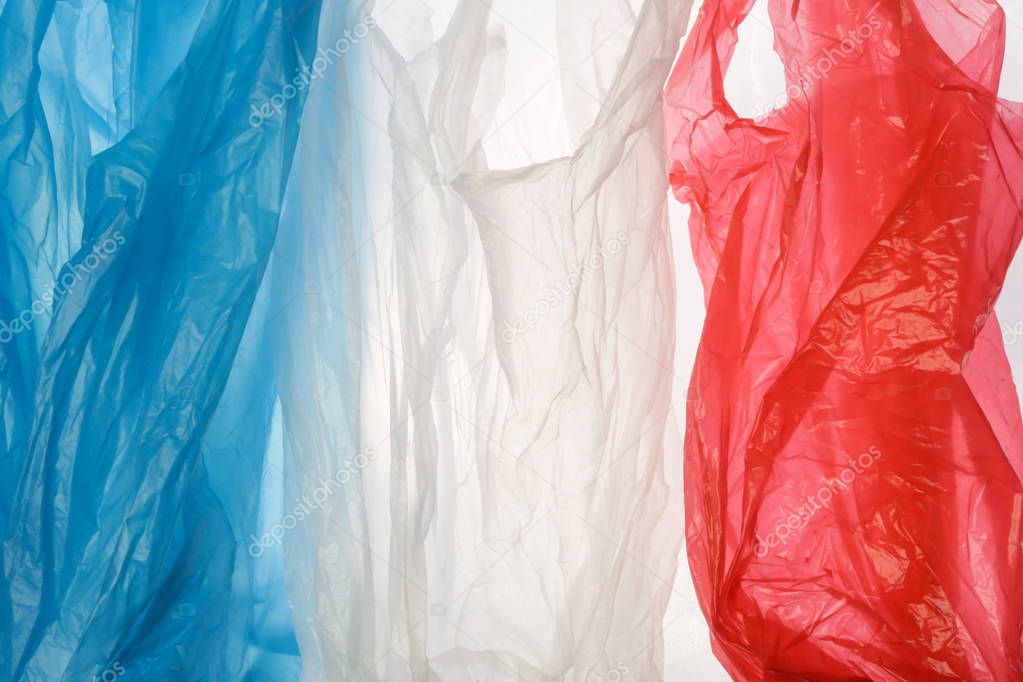 The flag of France made of plastic bags. A ban on single-use plastic products concept.