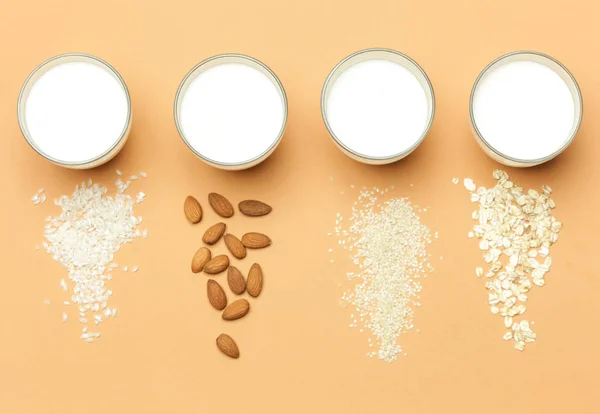 Organic vegan non-dairy plant-based milk, studio shot on bright orange background
