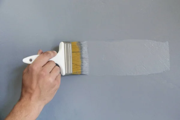 Man Painting Paintbrush Grey Wall — Stock Photo, Image