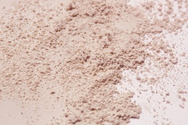 Pembe kozmetik kil tozu dokulu arka plan, yakın çekim,