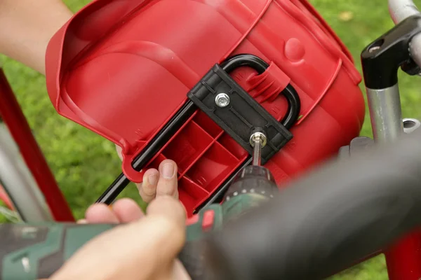 Front bicycle baby seat installation steps. A series of images, how to put kid seat on a bicycle handlebar