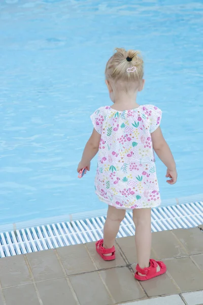 Portrait Beautiful Blonde Toddler Girl Floral Dress Standing Next Swimming — Stock Photo, Image