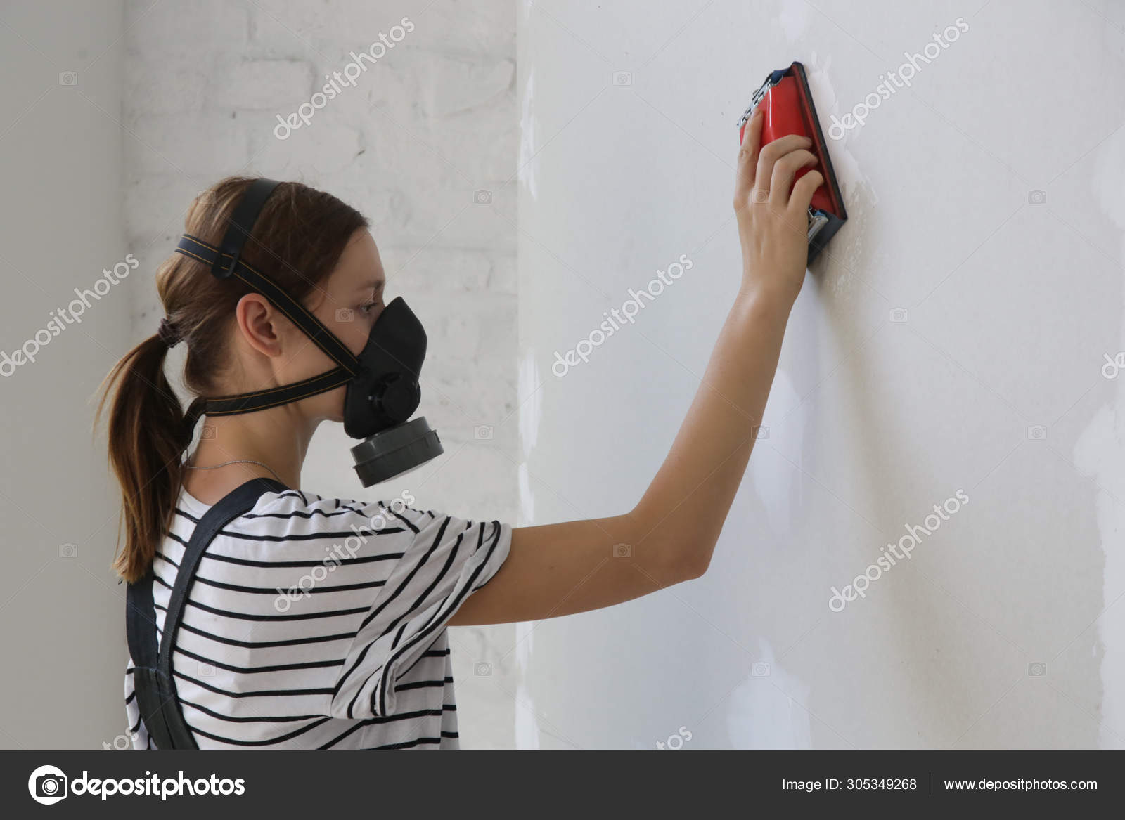 Young Woman Wearing Working Dust Protective Mask Sanding