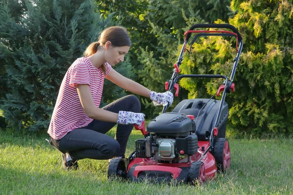 Woman Checking Lawn Mower Oil Outdoor Household Chores Concept — Stock Photo, Image