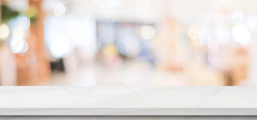 Empty white marble table over blur store background, banner, pro
