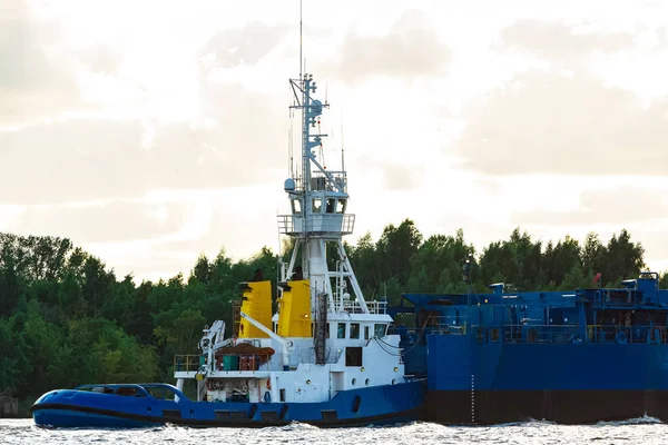 Blue Tug Ship Moving Cargo Terminal Industrial Services Stock Photo