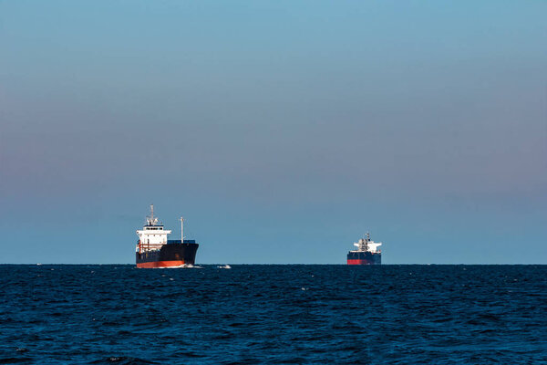 Black bulker ship. Logistics and merchandise transportations