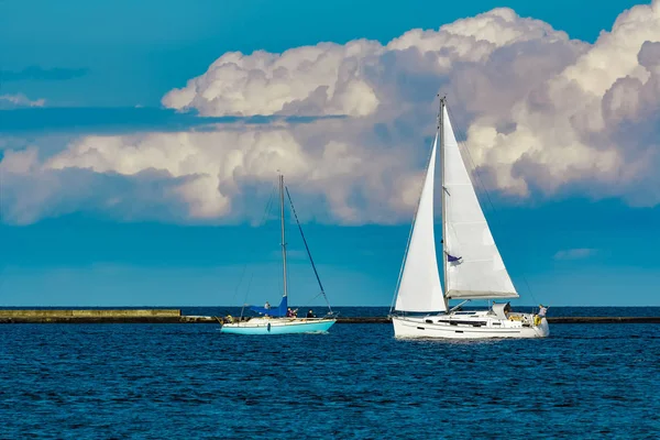 A fiew sailboats are traveling in Baltic sea. Summer journey