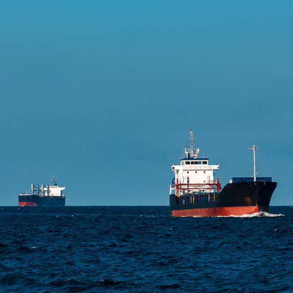 Black bulker ship. Logistics and merchandise transportations
