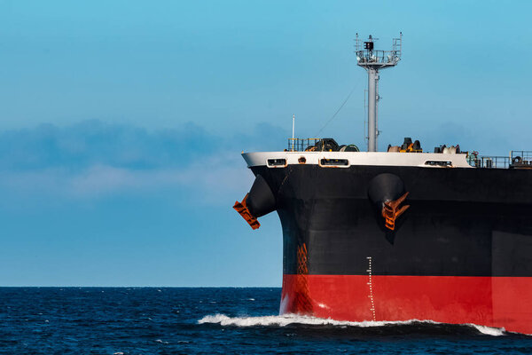 Black bulker ship. Logistics and merchandise transportations