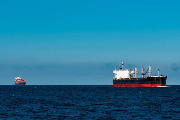 Black bulker ship. Logistics and merchandise transportations