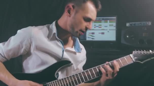 Yound Man Playing Electric Guitar at the Home Studio — Stock Video