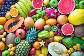Food background. Assortment of colorful ripe tropical fruits. Top view
