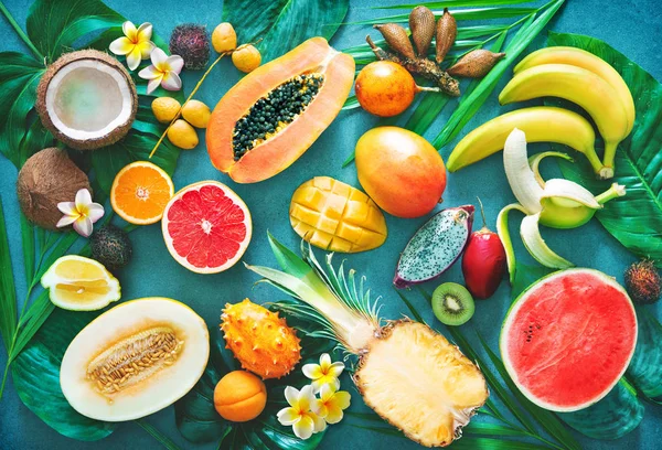 Assortment Tropical Fruits Palm Leaves Exotic Flowers Top View — Stock Photo, Image