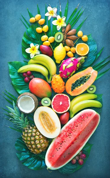 Assortment Tropical Fruits Palm Leaves Exotic Flowers Top View — Stock Photo, Image