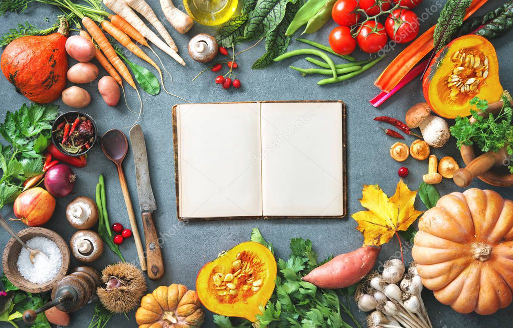 Healthy or vegetarian nutrition concept with selection of organic autumn fruits and vegetables on rustic wooden table