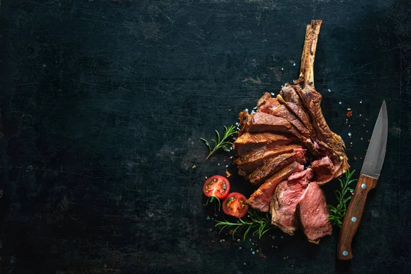 Grilled dry aged tomahawk steak sliced as close-up — Stock Photo, Image