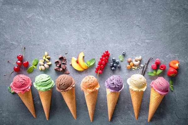 Various varieties of ice cream in cones — Stock Photo, Image