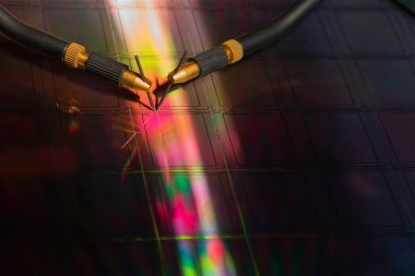 Checking microchips on silicon wafer with probe station.Close up . Semiconductor Crystal Manufacturing.Selective focus. clipart