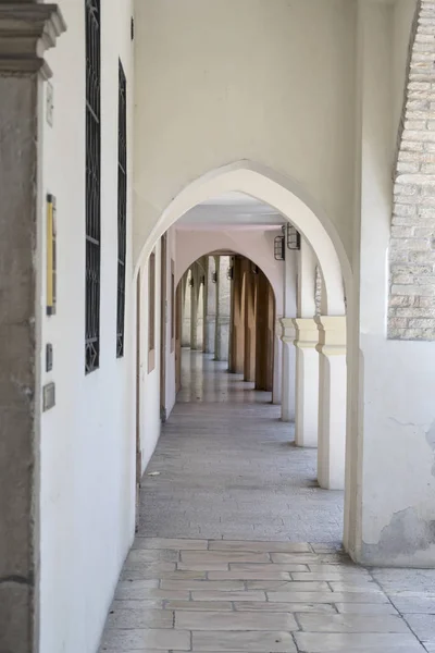 narrow arched covered walkway, Portogruaro , Italy